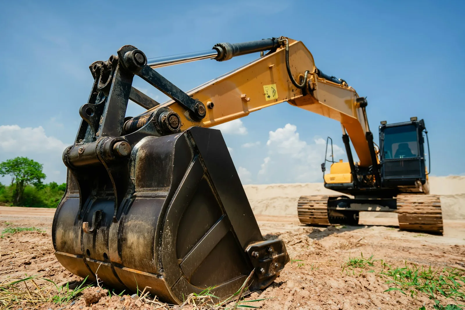 Yellow excavators at an earthworks construction site