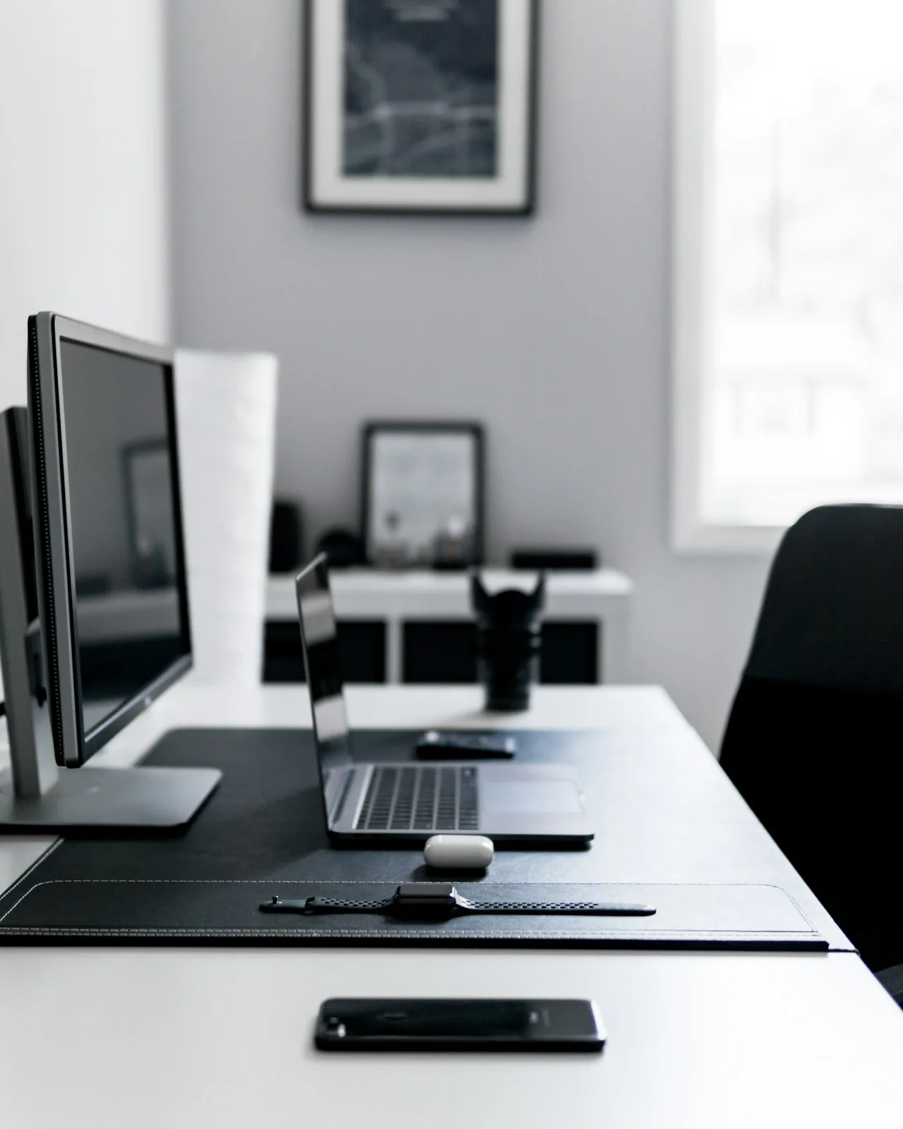 Laptop and office equipment arranged on a desk