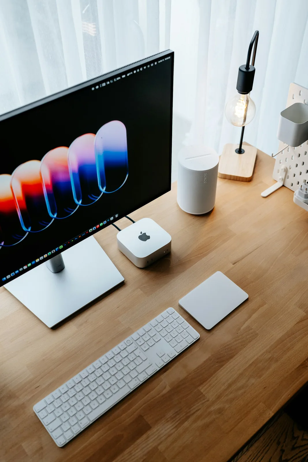 Desktop computer monitor, keyboard and mouse on a desk